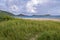 Orient Beach With a View of Lush Green Mountains of St. Martin on the Left and Pinel Island on the Right