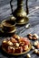 Oriental Arabian sweets with different nuts a cup of coffee. Eastern sweets. Traditional Turkish delight Rahat lokum on a wooden