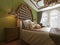 Oriental bedroom in Arab style, with a wooden headboard and green walls. TV unit, dressing table, armchair with coffee table