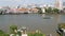 Oriental boat floating on river in Krungthep city. Modern transport vessel floating on calm Chao Praya river on sunny day in