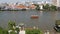 Oriental boat floating on river in Krungthep city. Modern transport vessel floating on calm Chao Praya river on sunny day in