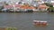 Oriental boat floating on river in Krungthep city. Modern transport vessel floating on calm Chao Praya river on sunny day in