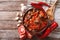 Oriental cuisine: lamb slow stewed with vegetables closeup. horizontal top view