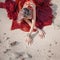 Oriental dance. Beautiful woman sitting on the sand, hands with bracelets on sand.