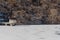 Oriental gazebo and walkway jutting out on frozen lake