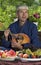 Oriental man playing mandolin