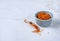 oriental spice saffron in a blue ceramic bowl on a marble table