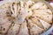 Oriental sweet dessert halva with walnuts close-up. Focus with shallow depth of field.