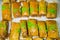 Oriental sweets Baklava made of golden puff pastry with rectangular nuts sprinkled with green pistachio chips. Fruits nuts