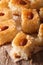 Oriental sweets: basbousa with almonds close-up. Vertical