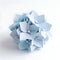 Origami blue hydrangea flower on white background, paper flower art, paper craft