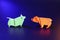 Origami bull and bear trading on dark background in neon light with copy space