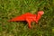 Origami dinosaur on grass