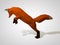 Origami fox on his hind legs. Polygonal fox jumping. Geometric style red fox, side view. Hunting fox. 3D illustration
