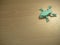 Origami Frog on wooden background
