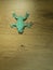 Origami Frog on wooden background