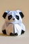 Origami panda on light background