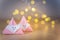 Origami Xmas scene with Santa claus and bokeh lights