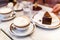 original authentic Viennese Sacher Torte cake served with whipped cream and cup of coffee at