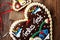 original bavarian christmas gingerbread heart on wood. xmas gingerbread cookie.