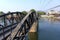 Original curved steel bridge spans on the Burma Railway Bridge on the River Kwai, Kanchanaburi