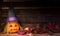 Original decorations with pumpkins and halloween witch hats on rustic wooden background