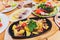 Original fajita sizzling smoking hot served on iron plate and fresh vegetables on background.