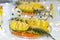 Original fruit slicing on the banquet table. Fruit sliced pineapple orange kiwi persimmon tangerine