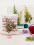 Original gift wrapping idea for Christmas. Recycled paper, colored wool threads and juniper twigs. Sustainable lifestyle