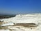 Original Pamukkale place in Turkey in Asia landscape with limestone pools with blue warm water