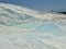 Original Pamukkale place in Turkey in Asia landscape with limestone pools with blue warm water