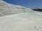 Original Pamukkale place in Turkey in Asia landscape with limestone pools with blue warm water