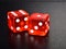 Original Red Casino Gambling Dice on Black Textured Reflecting Background