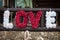 Original romantic valentyne flower sign the word love spelled wi