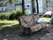 original sculpture in the city park in the form of a bench and a pillow and blankets lying on it