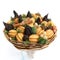 Original sweet gift in the form of a bouquet consisting of dried fruits, cookies, nuts on a white background
