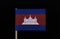 A original and unique flag of Cambodia on toothpick on black background. Three horizontal bands of blue, red and blue, with a