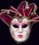 Original venetian mask isolated on black background.