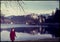 Original vintage colour slide from 1960s, woman standing by lake