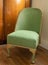 Original vintage deco green Lloyd Loom wicker rattan chair from the 1930s.