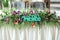 Original wedding table decor with flowers and the inscription