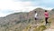 Orihuela, Spain - June 22, 2019: Group hiking going along hill on summer