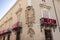 Orihuela, Spain - November 16, 2019: The corner of the facade of the house decorated with a figure of a bird and a coat of arms