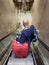 Orlando, Florida, U.S - November 11, 2023 - A passenger on the elevator with luggage to exit the airport