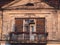 Ornamental balcony on a old run down house