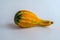 Ornamental bicolor pumpkin on white background