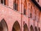 Ornamental brick arcade and windows in courtyard of Teutonic Malbork Caste, Poland