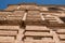 Ornamental building wall with terracotta bricks. Vertical viewpoint