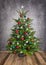 Ornamental Christmas tree on wooden floor