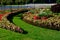 Ornamental flowerbed in front of the castle on the ground floor. The planting of annuals is in the shape of a circle with a moon s